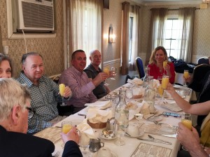 Member of the Hampton Rotary toast their last meeting.